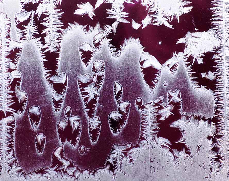 frost pattern on a window forms characters