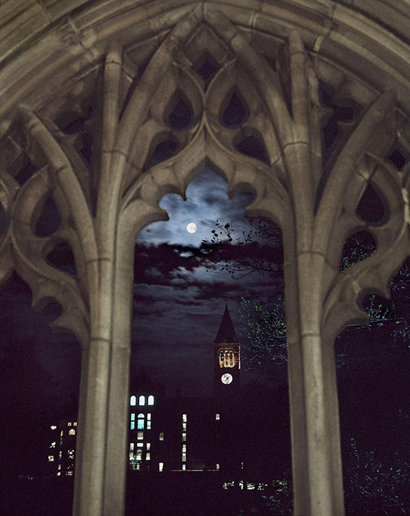 Moon and McGraw Tower framed in an arch of the War Memorial, Cornell U.