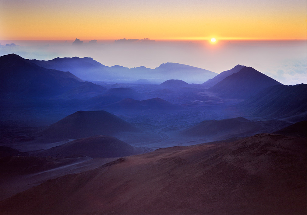 Sunrise near the summit of Haleakela showing ash cones in the crater